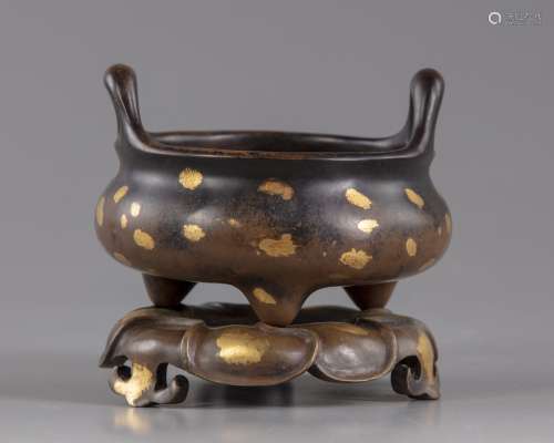 A Chinese gilt splashed bronze tripod censer and stand