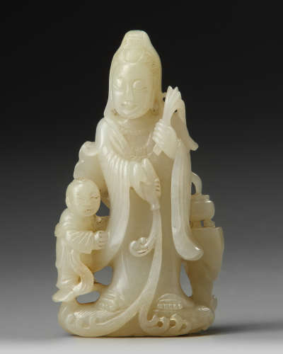 A Chinese pale jade carving of Guanyin and a boy