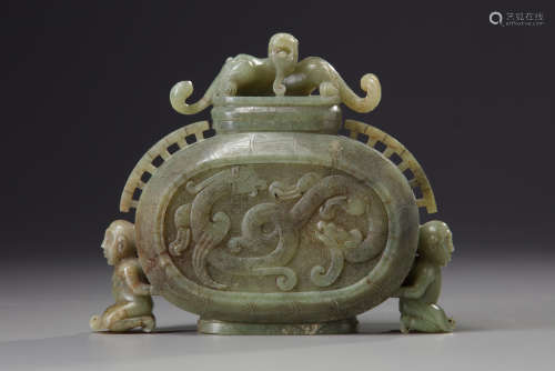 A Chinese celadon jade archaistic vase and cover