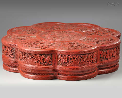 A large Chinese cinnabar lacquer floriform box and cover