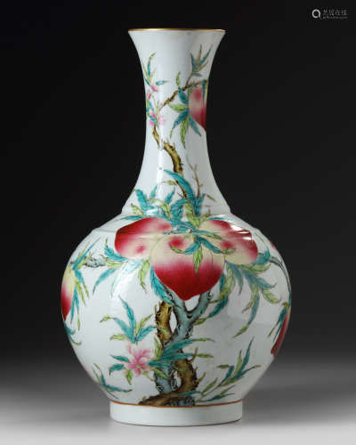 A Chinese famille rose peaches bottle vase