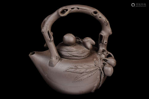 [Chinese] A Yixing Clay Pottery Teapot with Peach Branch Design, marked 