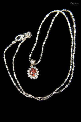 A Silver Set Ruby Pendant with Splint and Chain