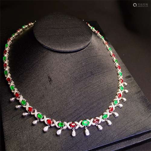 A Chinese Carved Jadeite and Ruby Necklace