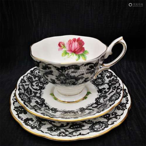 A British Black and White Glazed Porcelain Tea Cup with Plate