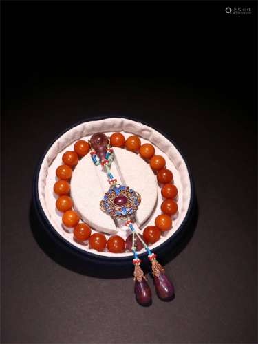 A Chinese Carved Amber Prayers Beads