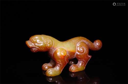 A Chinese Carved Jade Foo-Dog