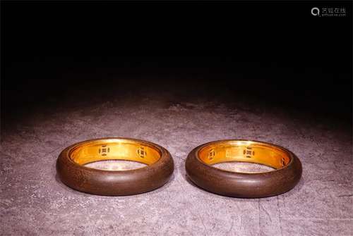 A Pair of Chinese Carved Agar-Wood Bracelets with Gilt Silver Inlaid