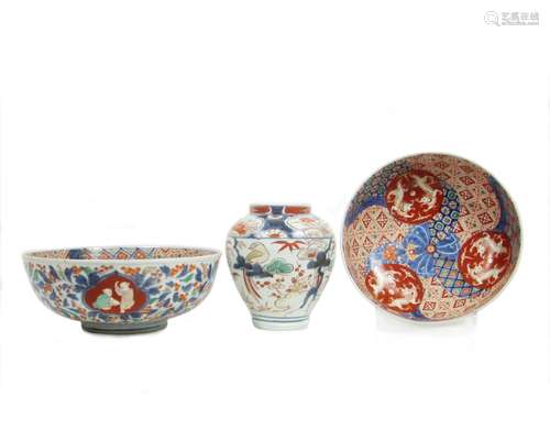 Edo period and 19th century An early Imari vase and two matching Imari bowls