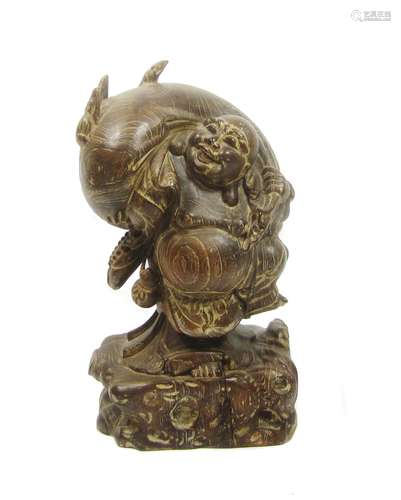 A large wood figure of Hotei