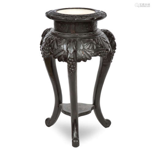 Circa 1900 A stained wood and marble topped jardinière stand