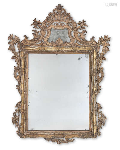 Lombardy, 19th century A large North Italian carved giltwood mirror