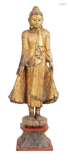 Thai, early 20th century A gilt-wood standing Buddha