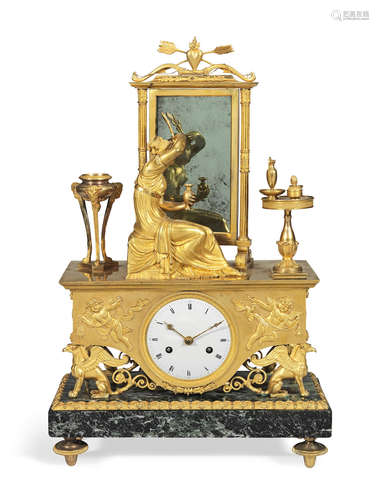 A good early 19th century French Empire ormolu and verde antico figural mantel clock