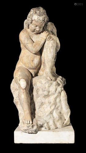 Italian, probably late 17th/ early 18th century  A carved marble figure of a putti