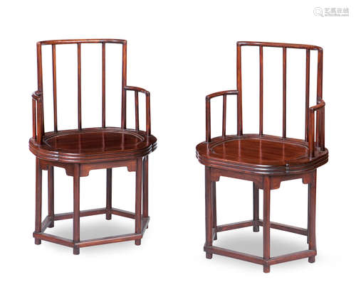 A set of four hardwood comb-back armchairs