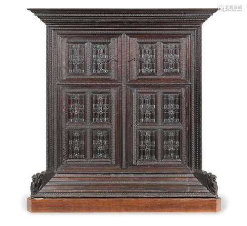 17th century and later A large German carved oak cupboard