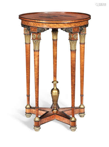 In the Empire style A French 19th century bird's eye maple, fruitwood marquetry and gilt and patinated bronze mounted gueridon