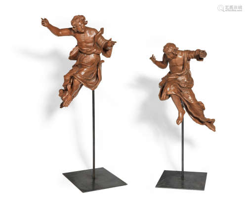 In the manner of Johann Paul Czechpauer, Bohemia A pair of early 18th century carved limewood angels in flight