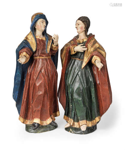 A pair of 18th century carved wood polychrome figures of female Saints