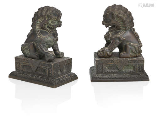 A pair of bronze Buddhist lion-dogs