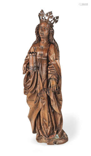 Early 16th century  A large carved fruitwood figure of St. Barbara