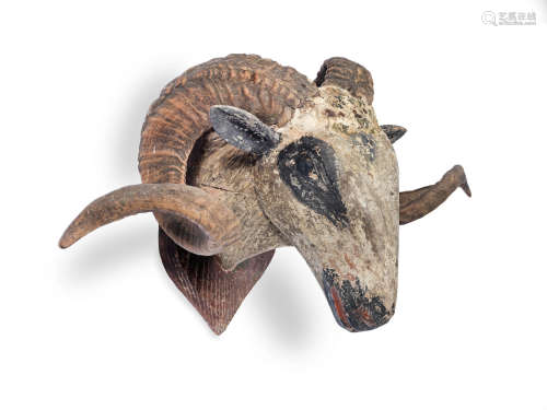 A 19th century ram's horn and carved and polychrome decorated trophy head of a ram