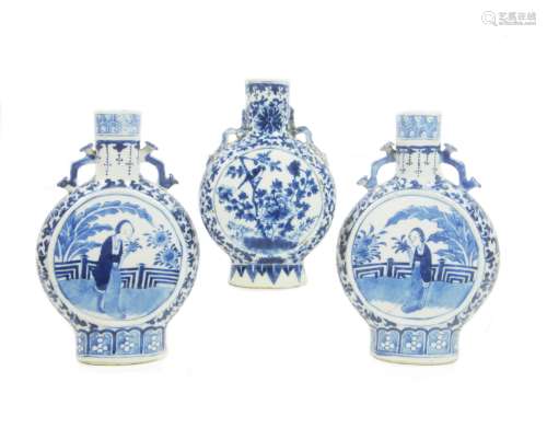 19th century A mirrored pair of blue and white moonflasks, and another