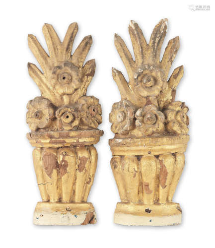 A pair of 18th Century carved giltwood floral-filled urns