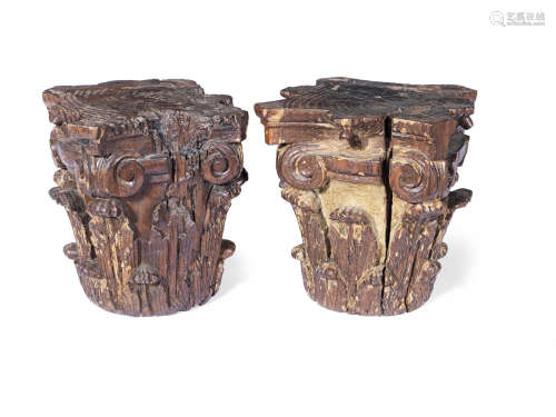 A pair of Spanish 17th Century carved walnut Corinthian capitals