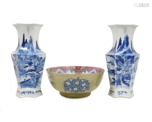 A pair of blue and white vases and a famille rose punch bowl