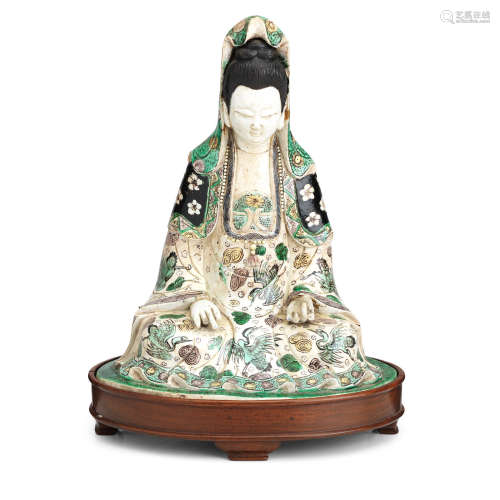 Late 19th/early 20th century A famille verte biscuit figure of Guanyin