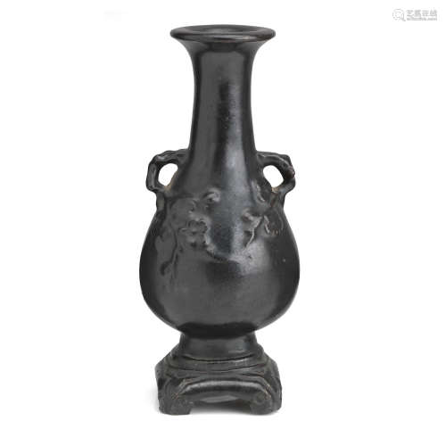 Ming Dynasty or later A black-glazed vase on integral stand