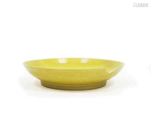 Six-character Yongzheng reign mark A yellow ground saucer dish