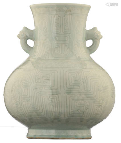 A Chinese pale celadon-glazed hu vase with incised banded archaic designs, lotus scrolls, ruyi lappets and fret pattern, the neck paired with mythical beast head handles, 19thC, H 46,3 cm