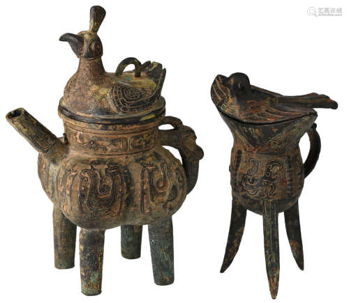 Two Chinese archaic bronze 'bird' ritual wine vessels, one vessel raised on a tripod, one vessel ding-shaped,  H 24,5 - 30,5 cm