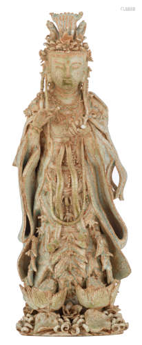 A Chinese qingbai ware Guanyin, standing on a lotus base, with flower and jewelled details all over the figure, H 29,5 cm 