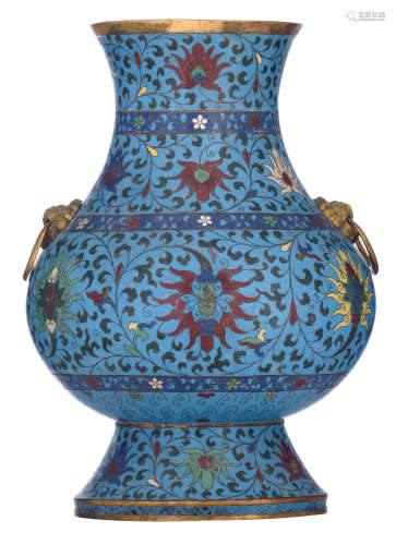 A Chinese cloisonné enamel hu vase, all over decorated with various flower sprays, including lotus, peony and magnolia, the neck paired with lion's head handles, with a Jingtai mark, H 38 cm