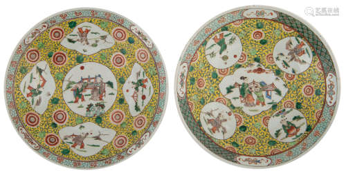 A pair of famille verte chargers, the roundels with playing boys, the central roundel with a scholar and a boy, 19thC, H 9,5 - ø 47 - 47,5 cm  
