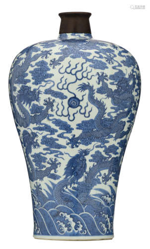 A Chinese blue and white large meiping vase, decorated with dragons, wallowing amongst clouds and above crashing waves, with a Qianlong mark, H 55 cm