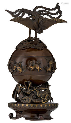 An Oriental bronze incense burner, the globular vessel relief decorated with Fu lions and carried by the dragon, with the phoenix standing on top of the cover, H 49,5 cm    