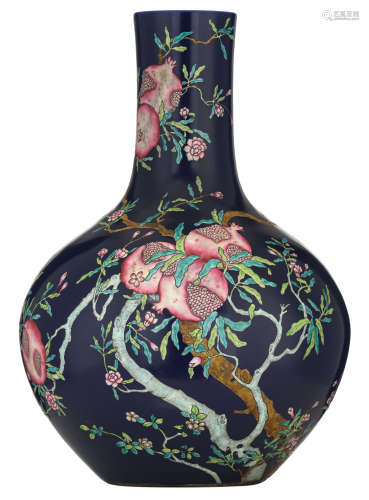 A Chinese blue ground famille rose tianqiuping, decorated with blossoming pomegranate tree branches, spread across the body and neck, bearing ripe fruit, H 58 cm