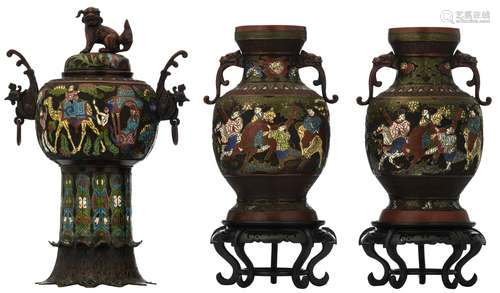 Two Oriental champlevé enamel bronze vases, decorated with horse riding figures, with chilong shaped handles; added: a ditto incense burner, decorated with figures, riding a camel and carrying a sedan chair, with a pair of phoenix shaped handles, H 51 - H 36 (without base) - 47,5 - 48 cm (with base)