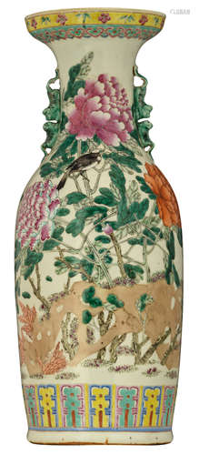 A Chinese polychrome decorated vase with birds on flower branches, with Fu lion handles, H 60,5 cm  