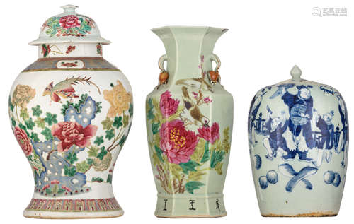 A Chinese famille rose vase and cover, decorated with a bird, a butterfly, flower bundles and pierced scholar's rocks; added: a ditto hexagonal vase with blossoming peonies and birds, with pomegranate-shaped handles; extra added: a celadon ground ginger jar, blue and white decorated with playing children, H 32 - 45 cm   