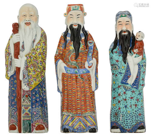 Three Chinese polychrome decorated figures, depicting Fu, Lu and Shou Xing, H 43,5 - 46,5 cm     