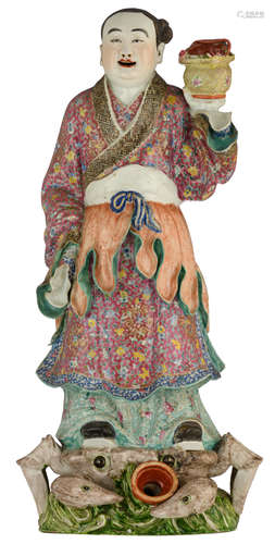 A Chinese polychrome decorated porcelain figure, depicting a girl, standing on a crab, symbolising the wish for many children, H 57 cm 