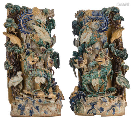 A fine pair of Chinese sancai vases, depicting a garden setting with relief decorations of a kylin, a phoenix, a pair of ducks, a goose and a bird on a pine, H 63 - 65 cm   