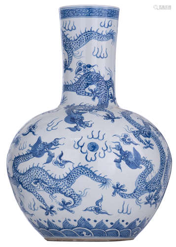 A Chinese blue and white tianqiuping, decorated with the five-clawed dragons chasing the flaming pearl amidst clouds, H 52 cm     