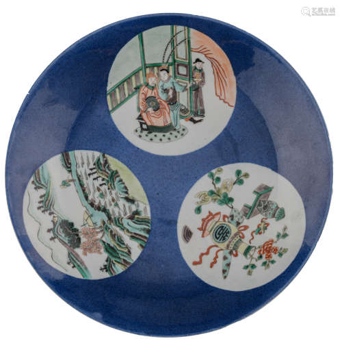 A Chinese bleu poudré plate, the roundels famille verte decorated with antiquities, figures and a mountainous landscape, with a Kangxi mark, ø 28 cm 